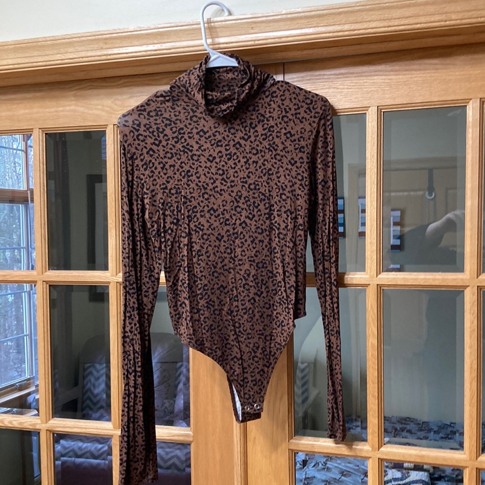 The Nines never worn body suite. Fits like a medium